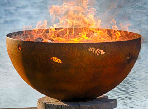 A large metal fire pit with flames.